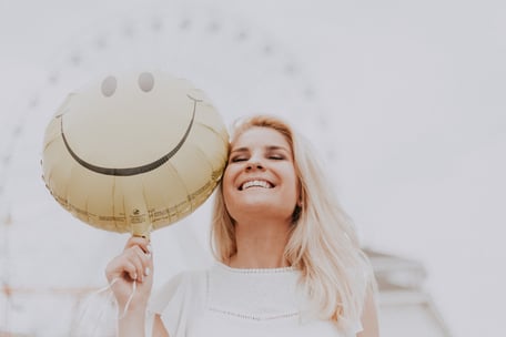 Girl with Smile balloon by pexels-julia-avamotive